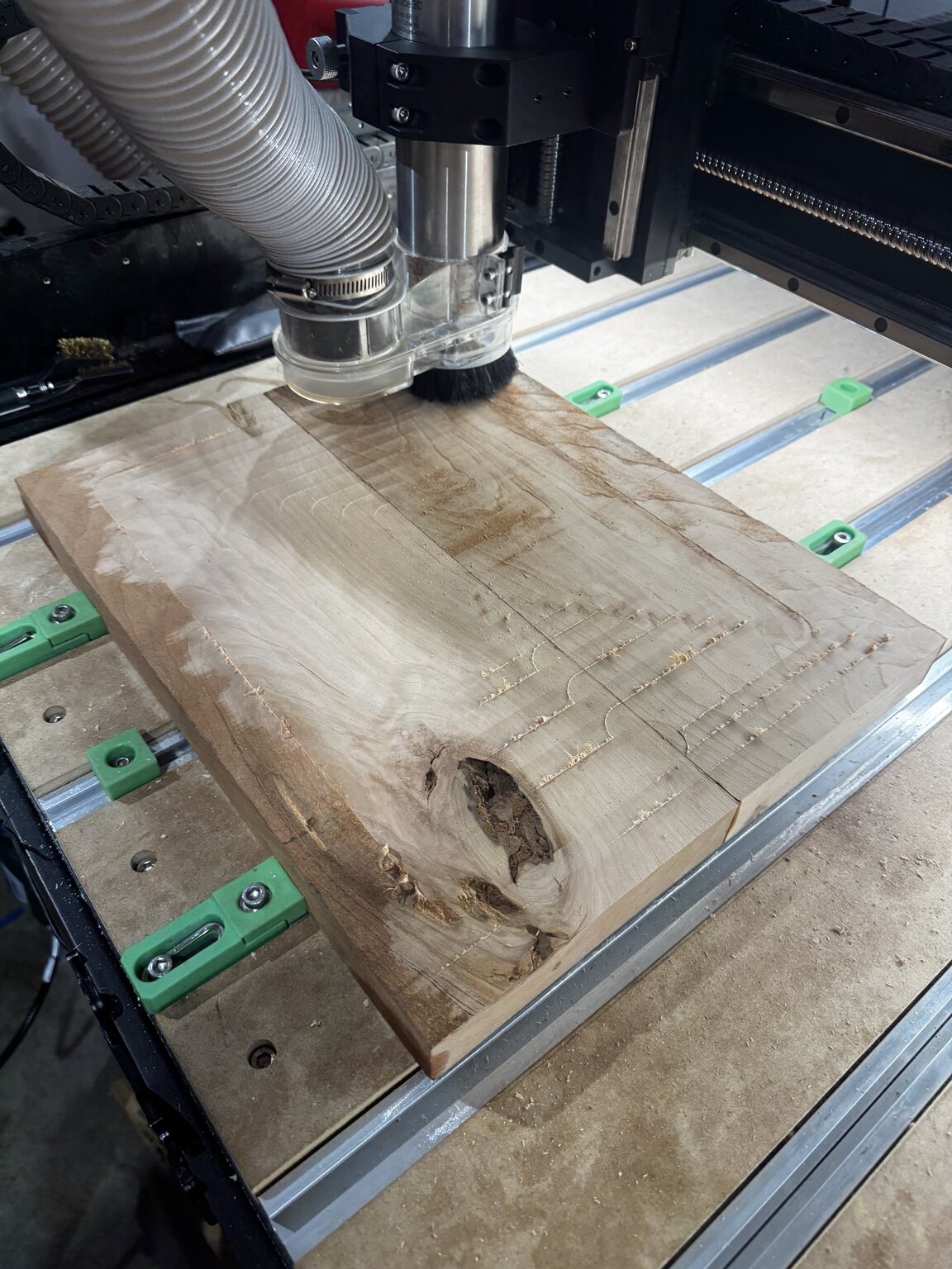 A hardwood board being surfaced and prepared